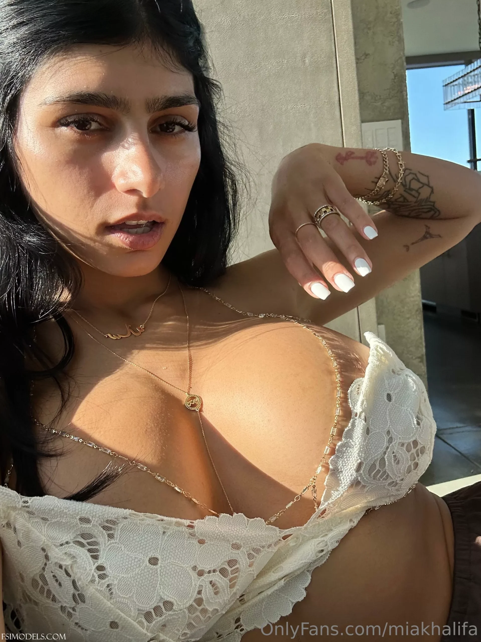 mia khalifa onlyfans white bikini boobs tease photos 011 scaled - FSI Models